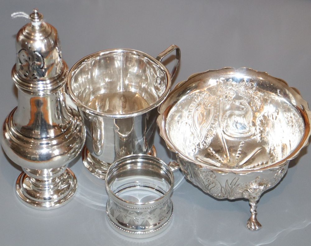 A George V silver sugar caster, sugar bowl, christening mug and napkin ring